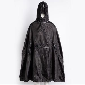Rain cape pancho in black foldable pocket detail